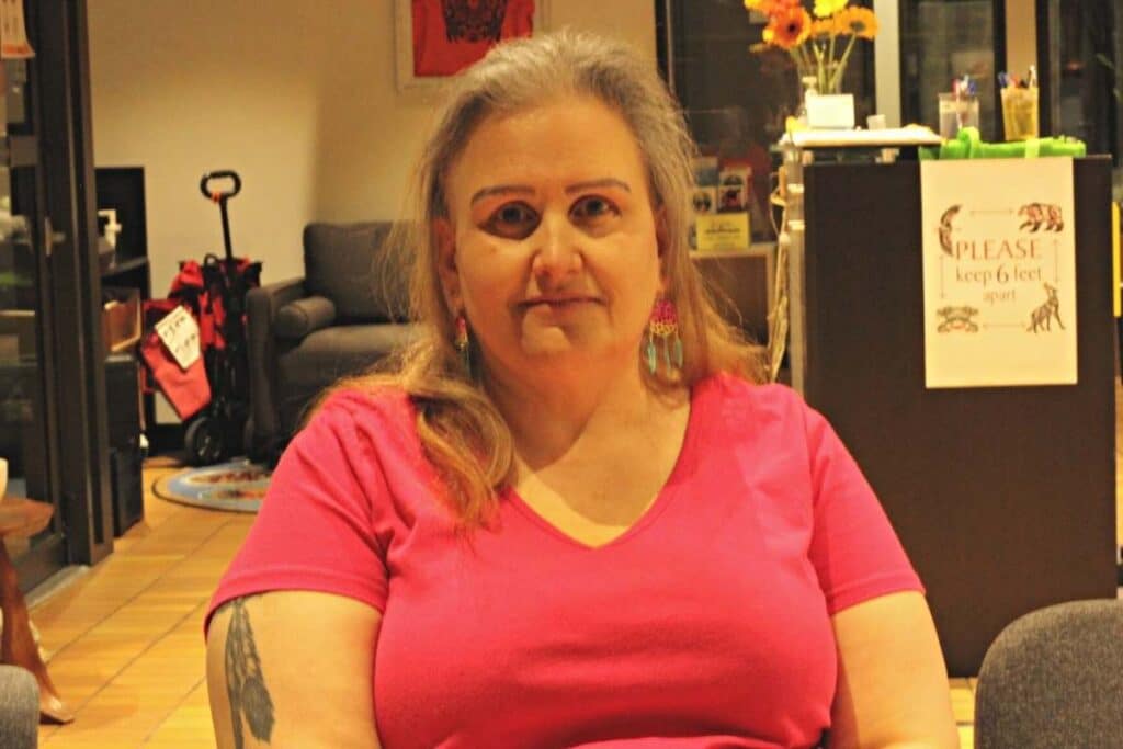 Jamie Saucier poses for a photo in the FRIS lounge