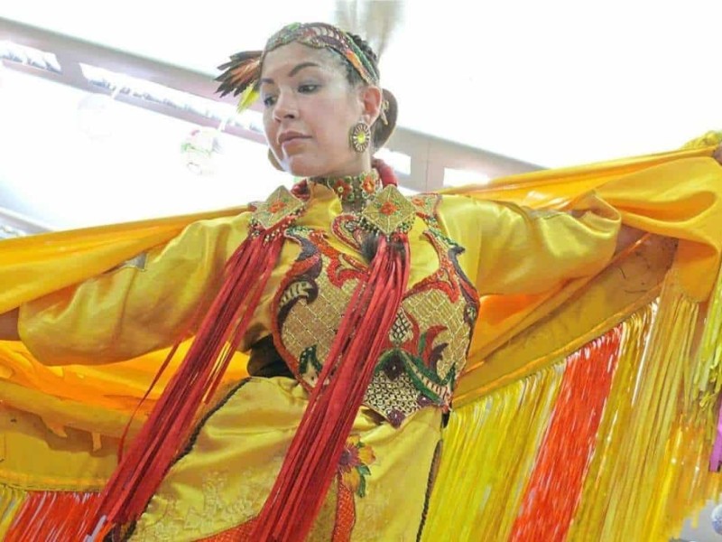 woman dressed in Indigenous regalia