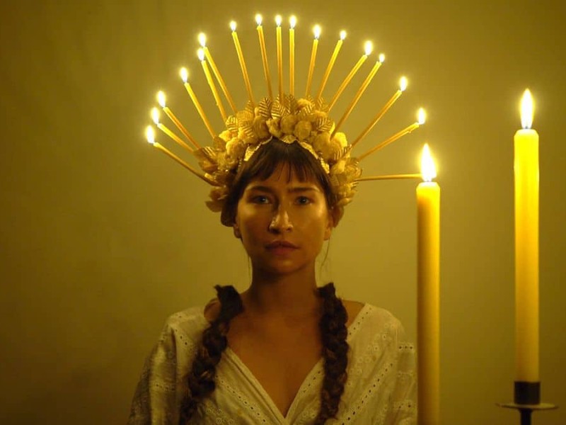 woman with candles on head